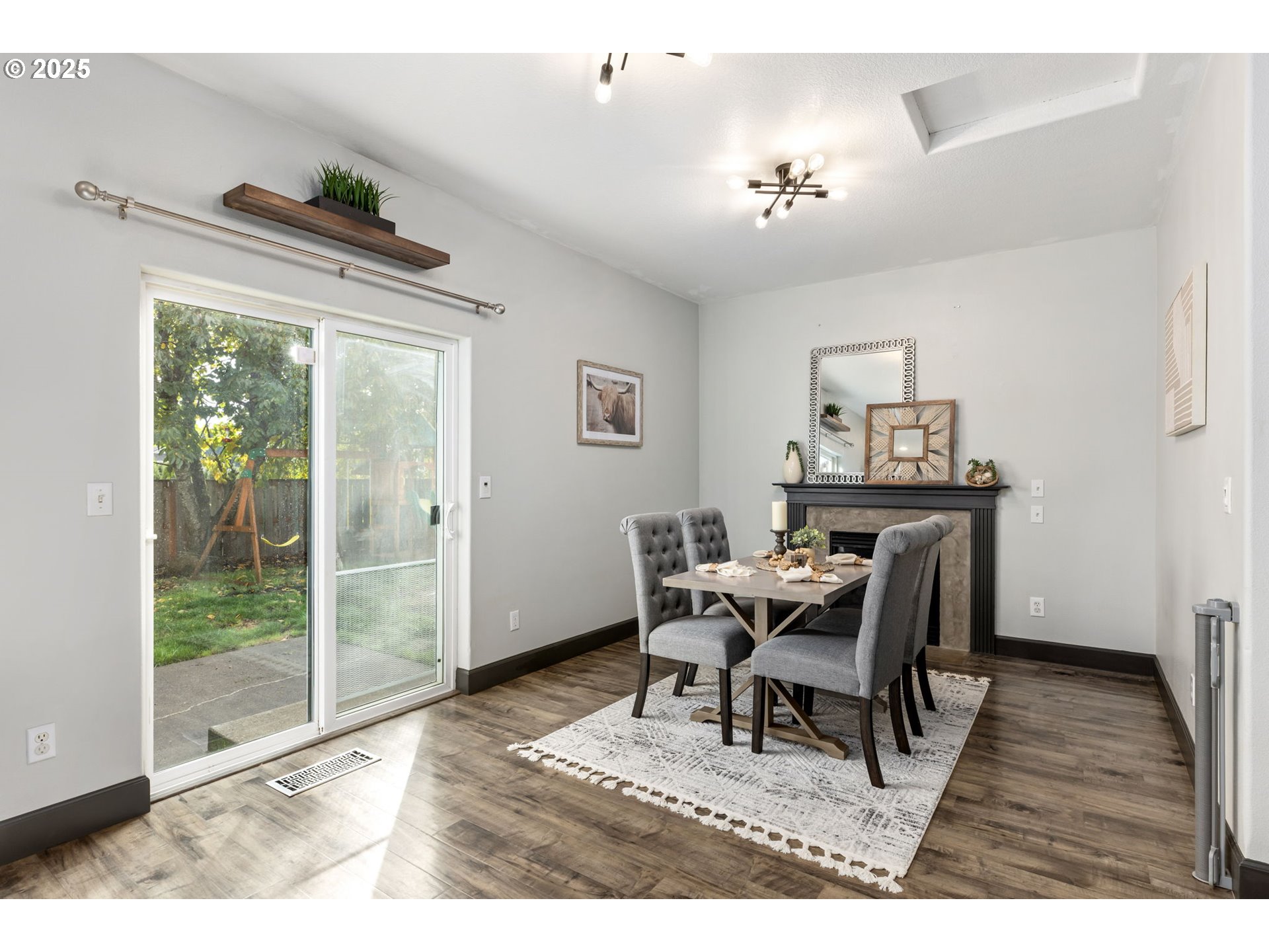51692 Southeast 3rd Street Scappoose, OR 97056 - Photo 6 of 22 a dining room with furniture and wooden floor