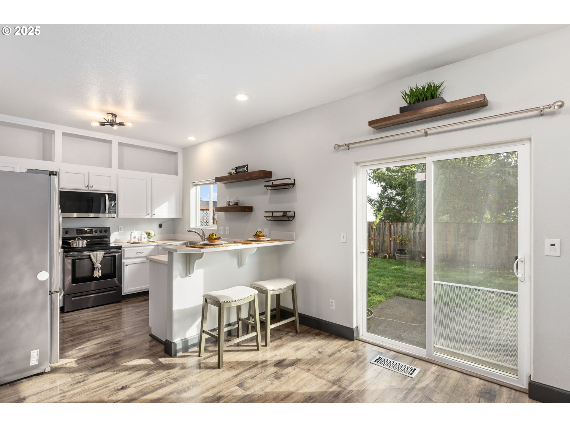 51692 Southeast 3rd Street Scappoose, OR 97056 - Photo 7 of 22 a kitchen with a table and chairs