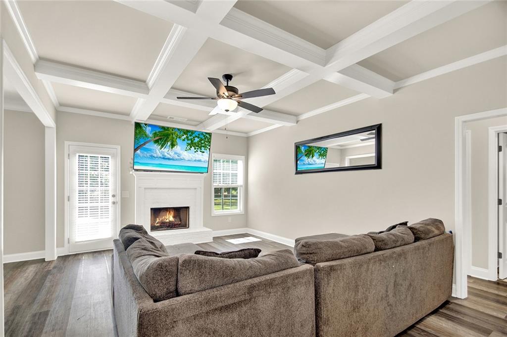 407 Corinth Church Road Winder, GA 30680 - Photo 23 of 66 a living room with furniture and a fireplace