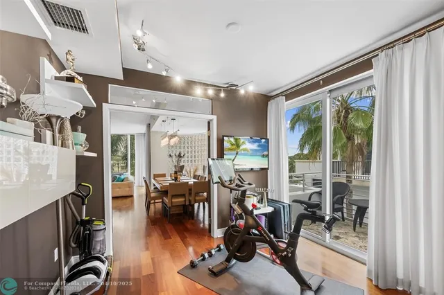 a view of a livingroom with furniture and hardwood floor