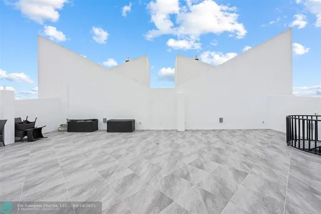 a view of swimming pool with outdoor seating and city view