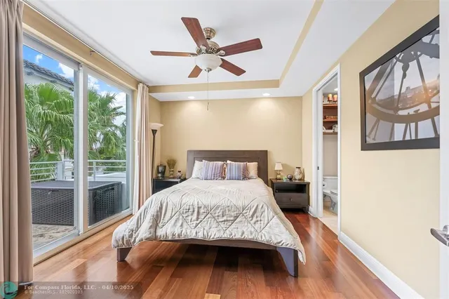 a bedroom with a large bed and a large window