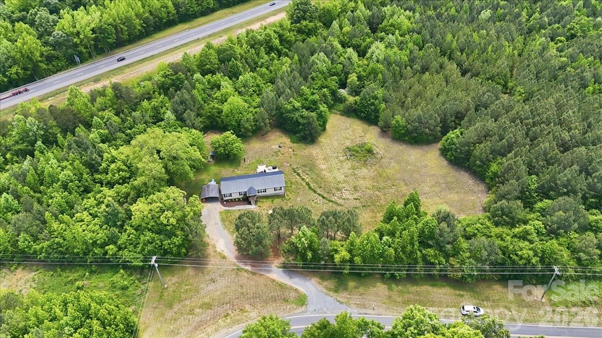 567 Godbey Road Mocksville, NC 27028 - Photo 31 of 38 a view of a lake with a house in the background