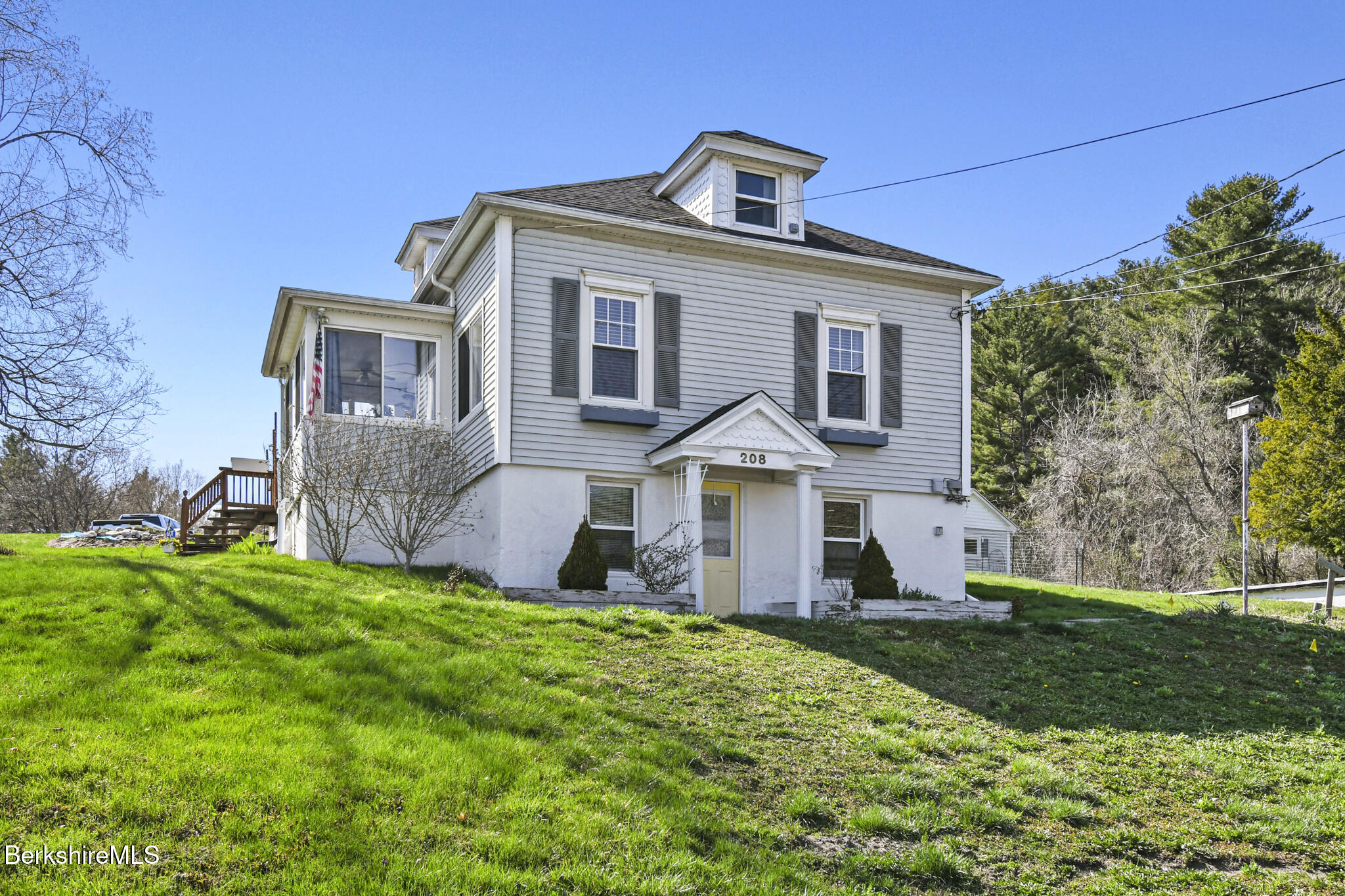 208 Jason Street Pittsfield, MA 01201 - Photo 1 of 32 a front view of a house with a yard