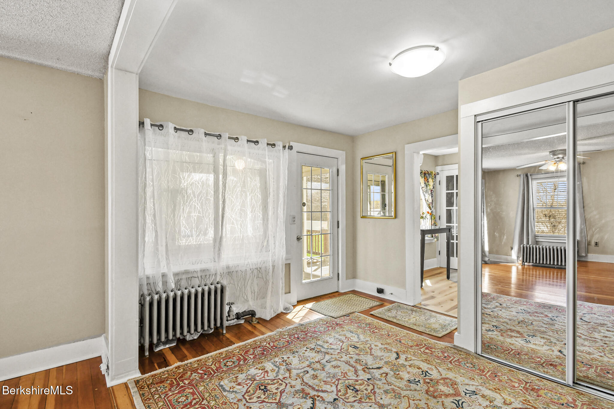 208 Jason Street Pittsfield, MA 01201 - Photo 12 of 32 a view of a room with wooden floor and a window