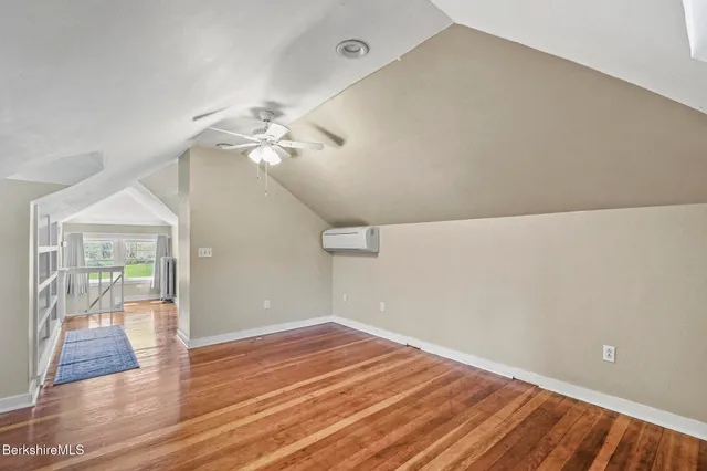 a view of staircase with a rug