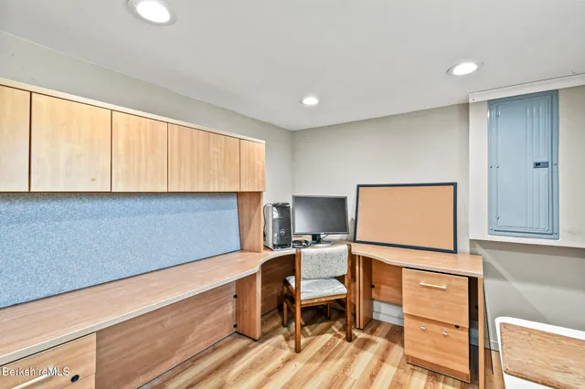 a view of a room with wooden floor