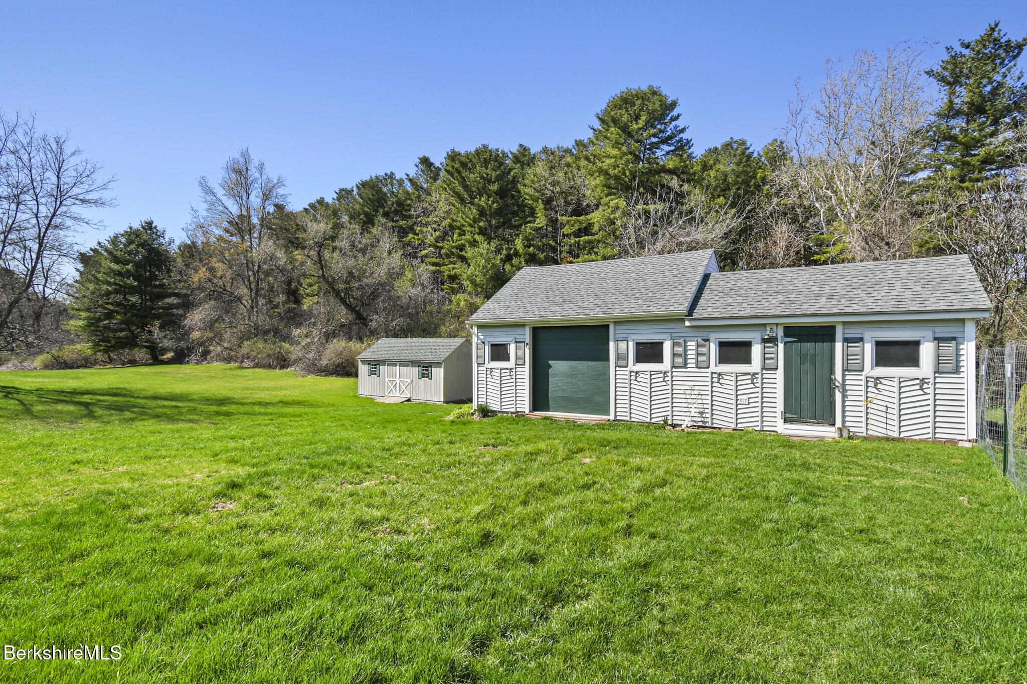 208 Jason Street Pittsfield, MA 01201 - Photo 31 of 32 a front view of a house with yard and green space