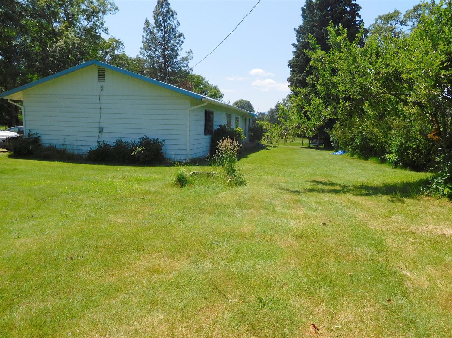 5685 Holland Loop Road Cave Junction, OR 97523 - Photo 2 of 18 The home faces N/E, and the back of the