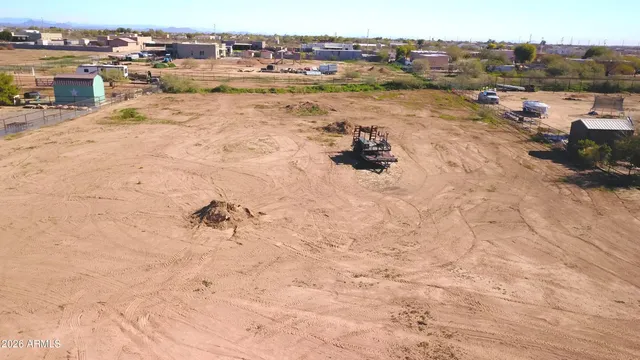 an aerial view of ocean and residential houses