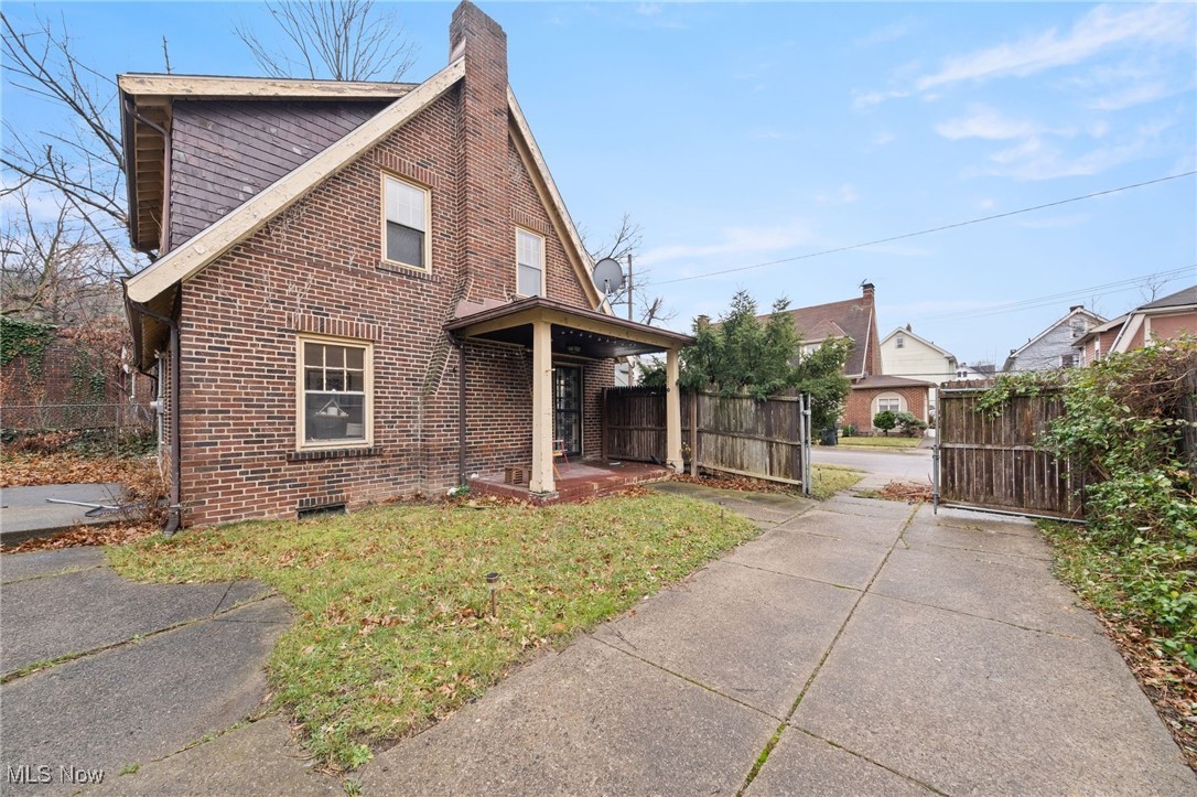 1857 Willowhurst Road Cleveland, OH 44112 - Photo 22 of 26 View of side of property featuring a lawn