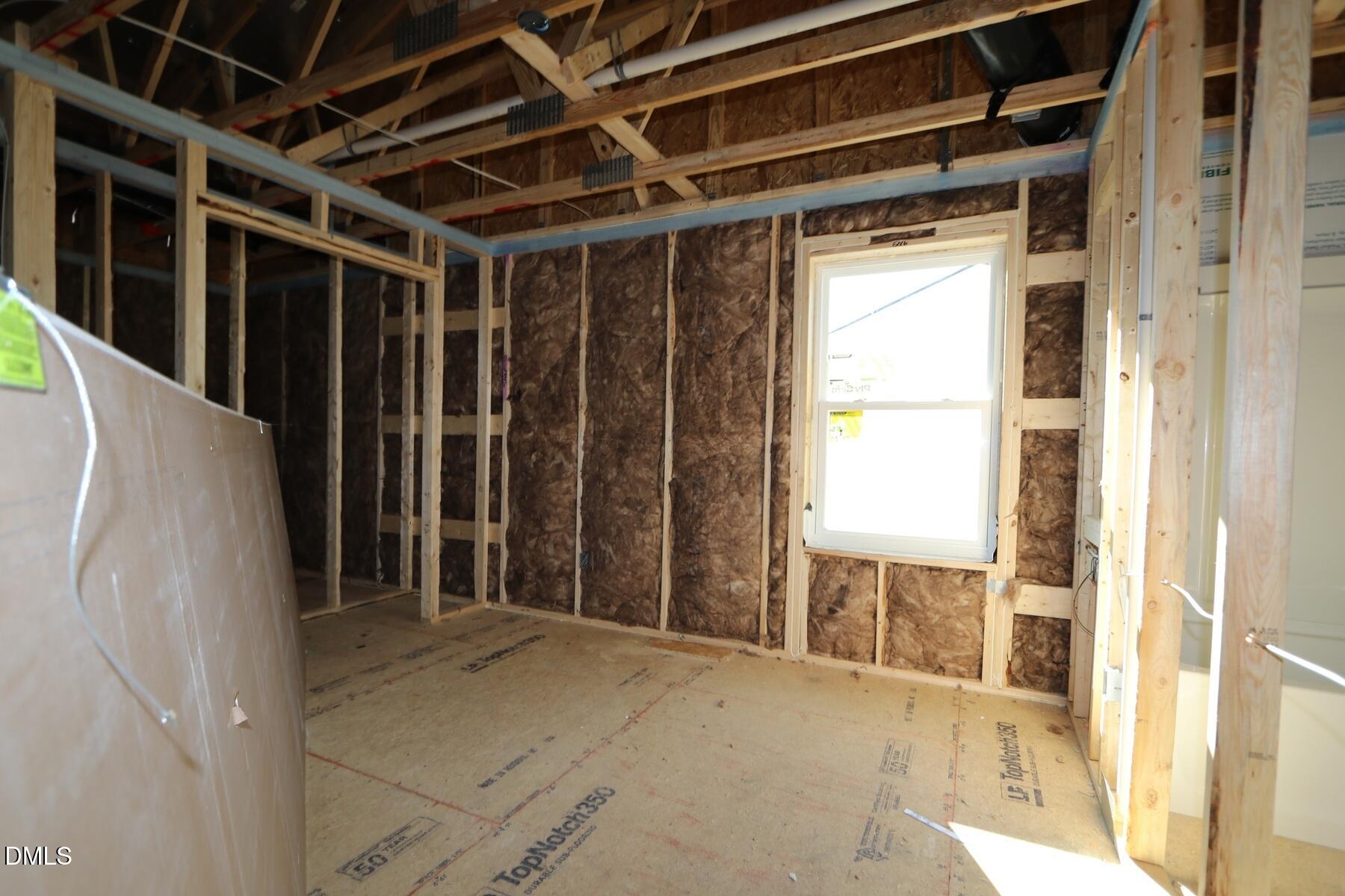 4412 Stengel Street Raleigh, NC 27616 - Photo 14 of 18 a view of an empty room with wooden floor and a window