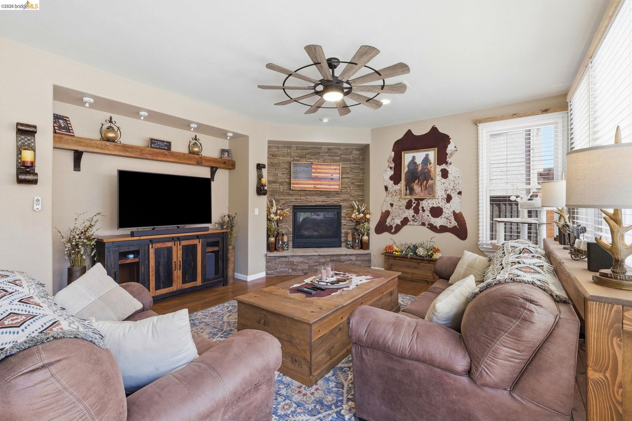 3438 Keystone Loop Discovery Bay, CA 94505 - Photo 9 of 57 a living room with furniture a flat screen tv and a window