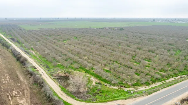 a view of a field with an outdoor space