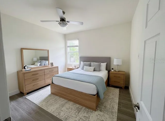 a room with a bed and a dresser