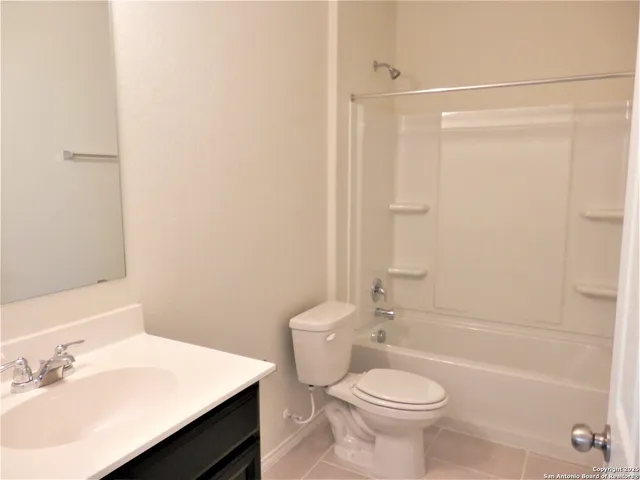 a view of a living room with furniture and a window