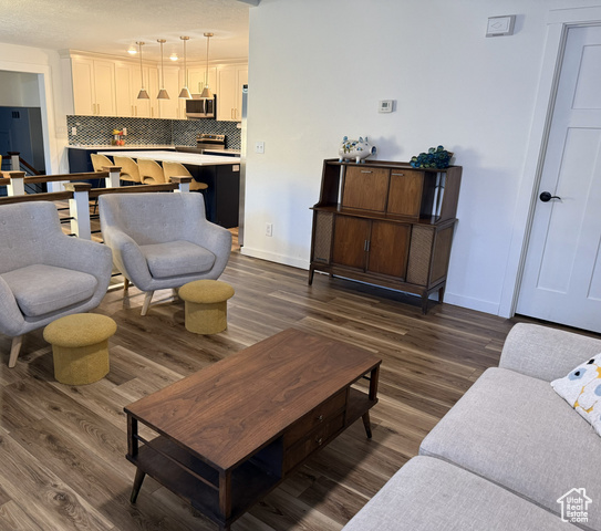 175 North 160 East Hurricane, UT 84737 - Photo 8 of 43 Living area featuring dark wood-style floors and a textured ceiling