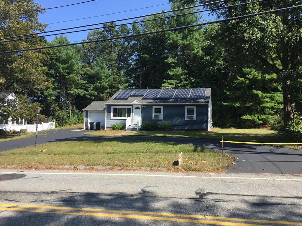 36 Concord Road Chelmsford, MA 01824 - Photo 1 of 27 a front view of a house with a yard