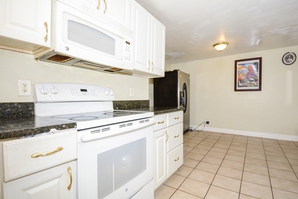 36 Concord Road Chelmsford, MA 01824 - Photo 11 of 27 a kitchen with cabinets and appliances