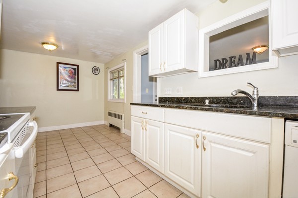 36 Concord Road Chelmsford, MA 01824 - Photo 12 of 27 a kitchen with a sink and cabinets