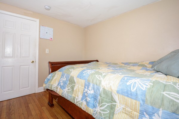 36 Concord Road Chelmsford, MA 01824 - Photo 16 of 27 a bedroom with a bed and wooden floor