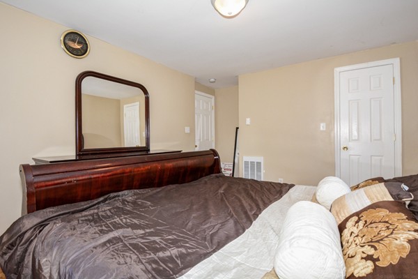 36 Concord Road Chelmsford, MA 01824 - Photo 19 of 27 a bedroom with a bed and a dresser