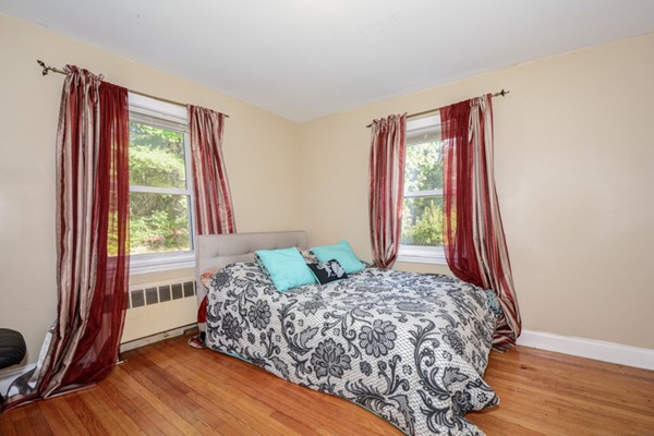 36 Concord Road Chelmsford, MA 01824 - Photo 20 of 27 a bedroom with a bed and a large window