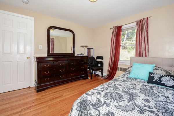 36 Concord Road Chelmsford, MA 01824 - Photo 21 of 27 a bedroom with a bed and a dresser