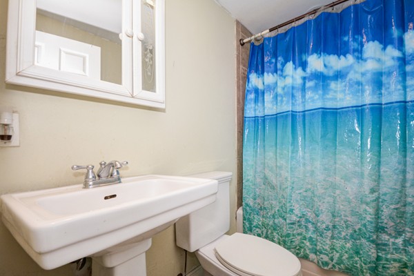 36 Concord Road Chelmsford, MA 01824 - Photo 22 of 27 a bathroom with a sink a toilet and a mirror