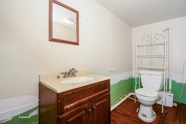 36 Concord Road Chelmsford, MA 01824 - Photo 23 of 27 a bathroom with a toilet sink and mirror