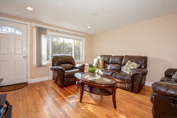 36 Concord Road Chelmsford, MA 01824 - Photo 6 of 27 a living room with furniture and a large window