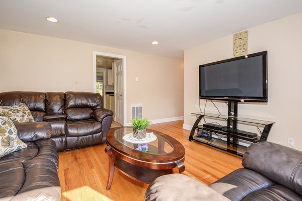 36 Concord Road Chelmsford, MA 01824 - Photo 7 of 27 a living room with furniture and a flat screen tv