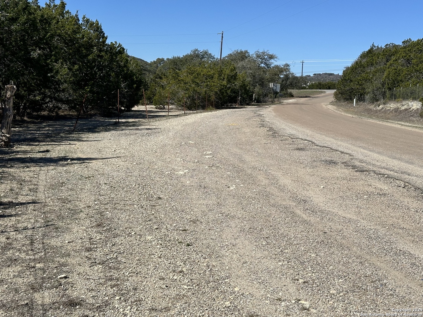 4621 McCall Creek Road Blanco, TX 78606 - Photo 2 of 36 a view of a rural road with plants