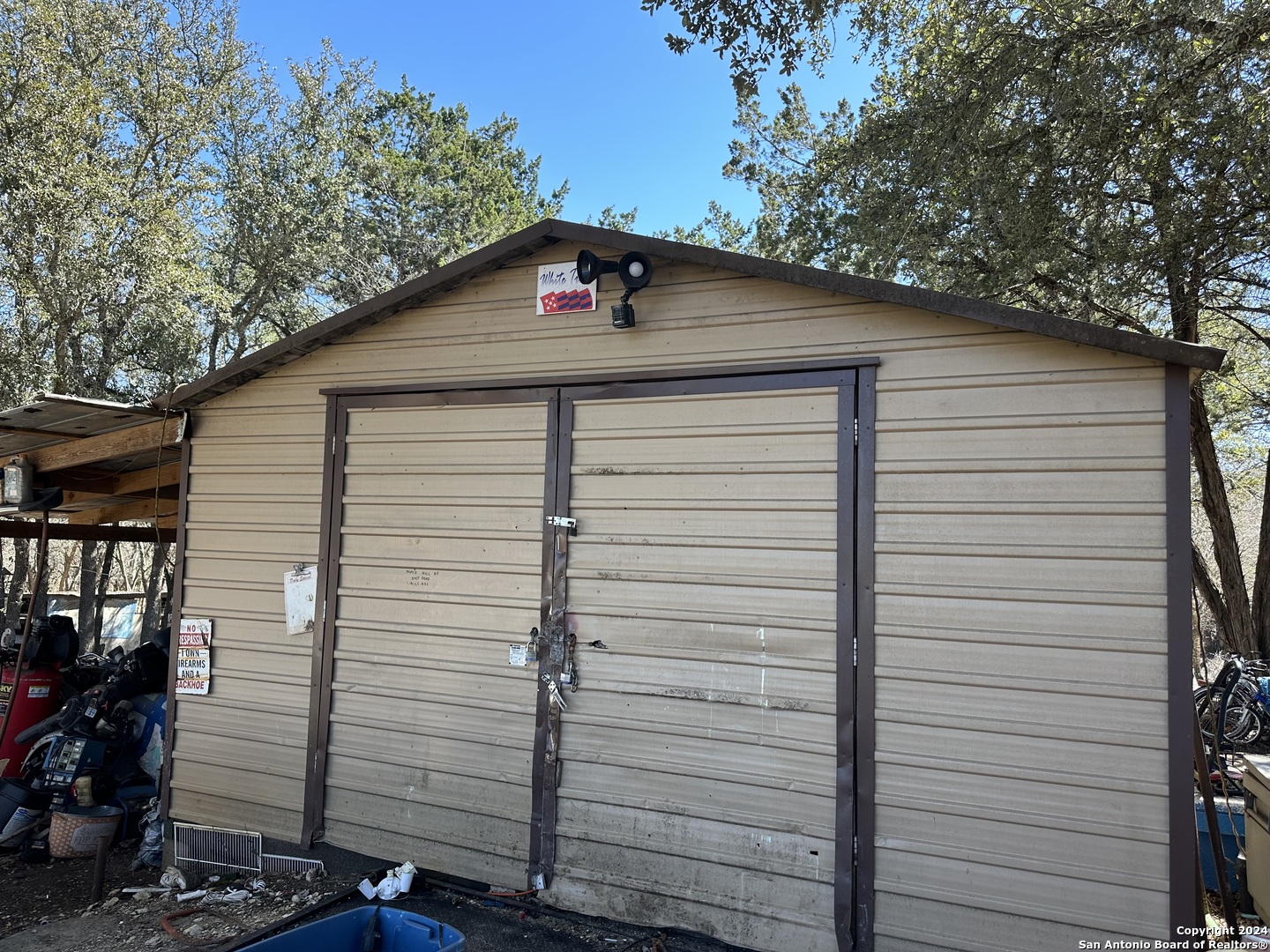 4621 McCall Creek Road Blanco, TX 78606 - Photo 29 of 36 a small white building with a white roof and stairs