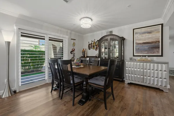 a dining room with furniture and window
