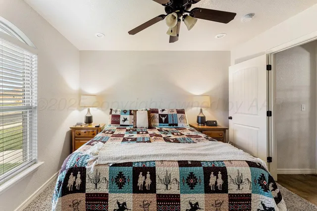 a bed in a bedroom next to a window