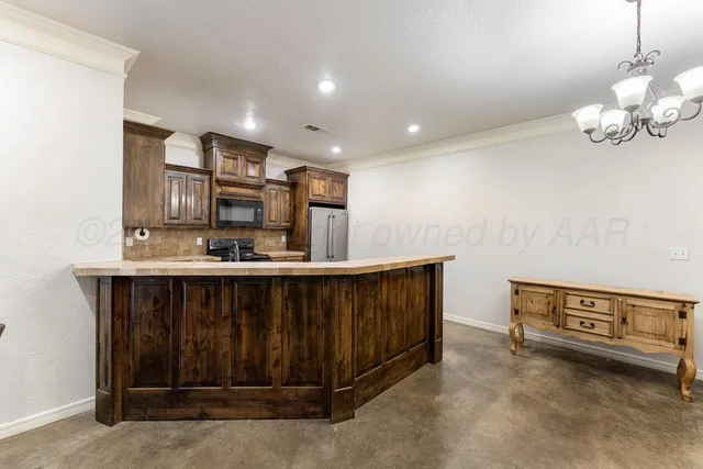 a kitchen with a sink cabinets and window