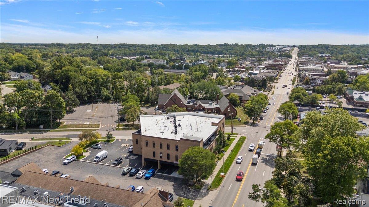 804 North Main Street, Unit 2H Rochester, MI 48307 - Photo 48 of 52 Multi-story commercial building with brick facade and multiple surface parking areas