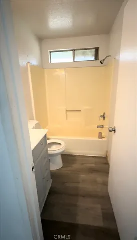 a view of a room with window wooden floor and windows