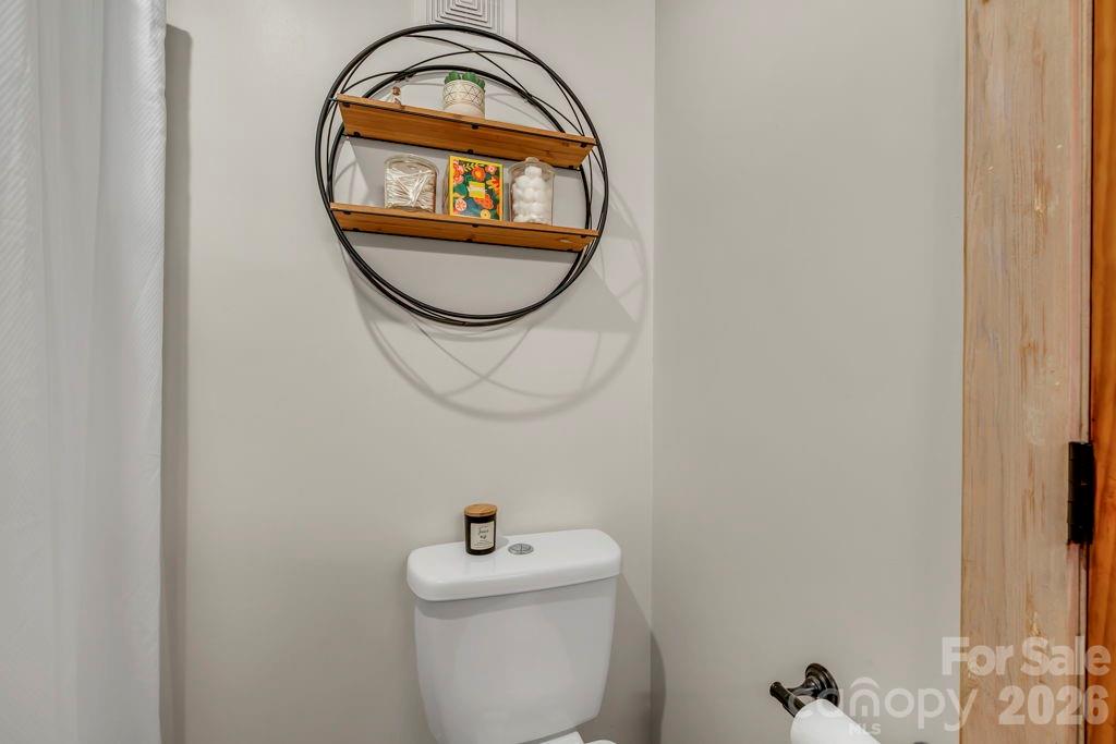 192 Dewitt Barnett Road, Unit 2 Vilas, NC 28692 - Photo 16 of 32 a bathroom with a toilet and a sink