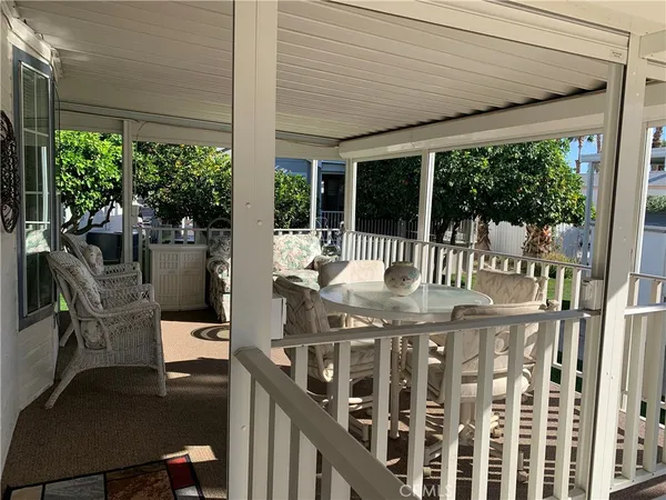 a view of a patio with table and chairs