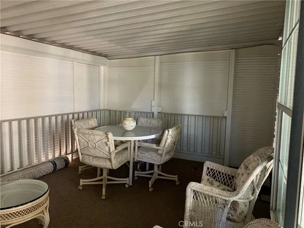 a outdoor dining space with furniture and outdoor view