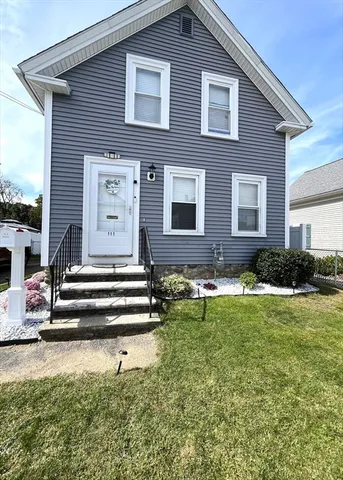 a front view of a house with a yard
