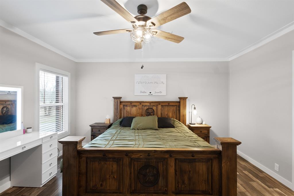 1012 County Road 1180 Decatur, TX 76234 - Photo 12 of 34 a bedroom with a bed and a window