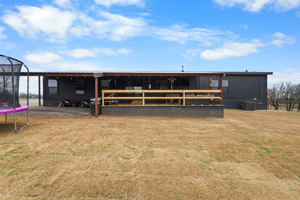 1012 County Road 1180 Decatur, TX 76234 - Photo 32 of 34 a view of a terrace with a bench