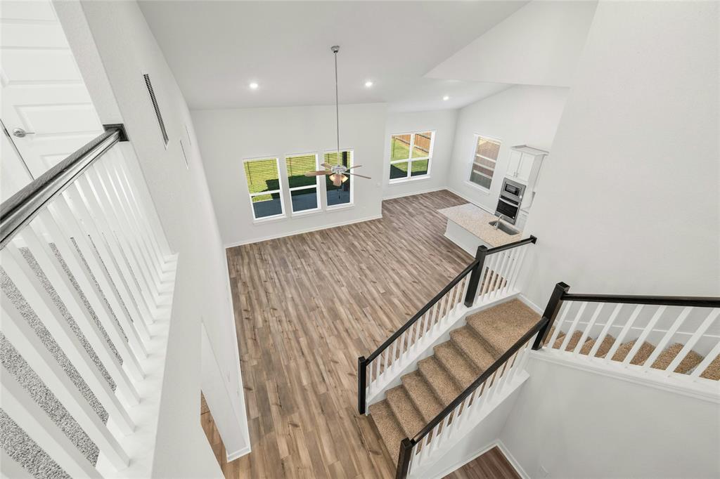 113 Shadow Oak Cove Georgetown, TX 78628 - Photo 24 of 40 Overlooking a spacious living area and contemporary kitchen, this home boasts high ceilings and abundant natural illumination.