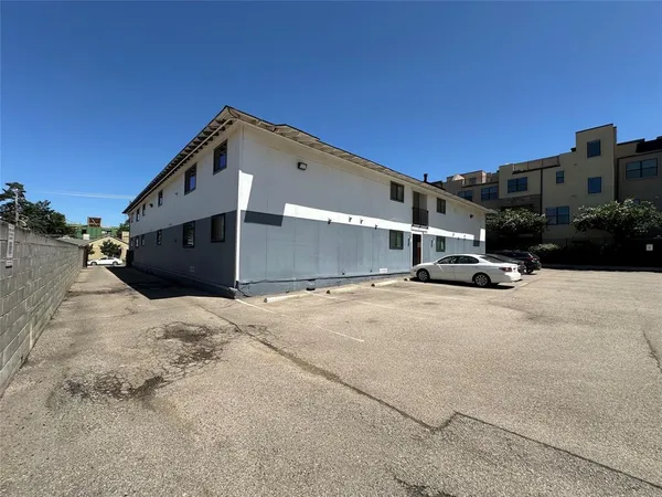 a view of street with parked cars
