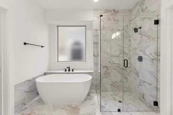 a bathroom with a shower and a sink