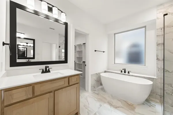 a bathroom with a double vanity sink mirror and double