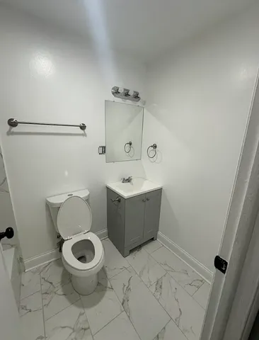 a bathroom with a toilet and a sink